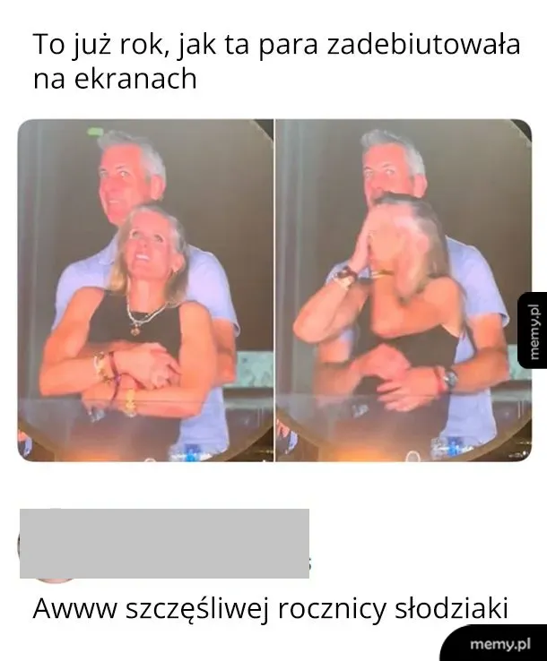 Dwie osoby przytulają się na tle sceny.